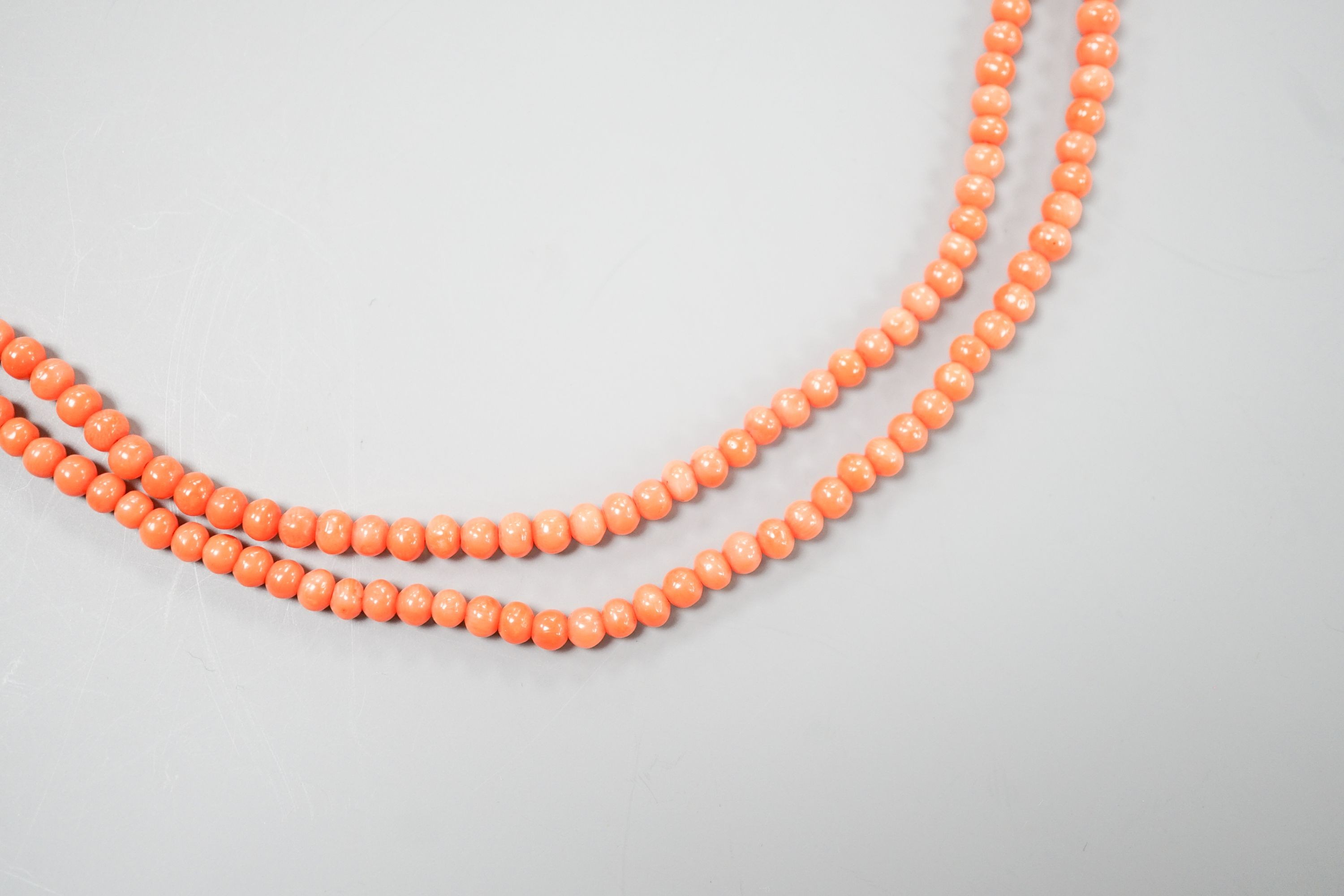A single strand graduated coral bead necklace, 93cm, gross weight 28 grams.